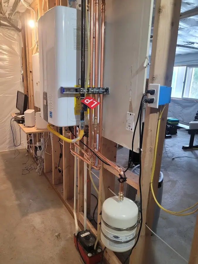 Licensed plumber repairing a kitchen sink in Flemington
