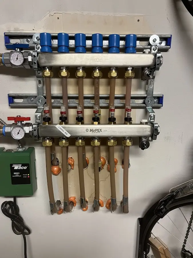 Plumber performing Water Heater Repair at a residential property in Flemington